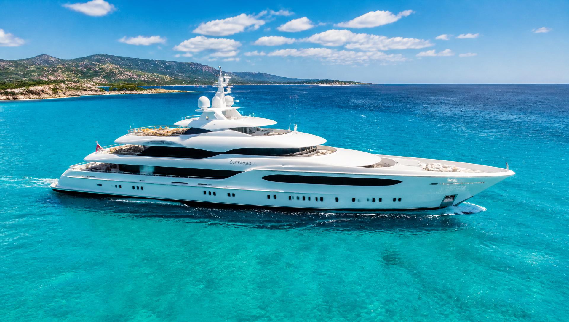 Luxury superyacht at anchor in a turquoise bay